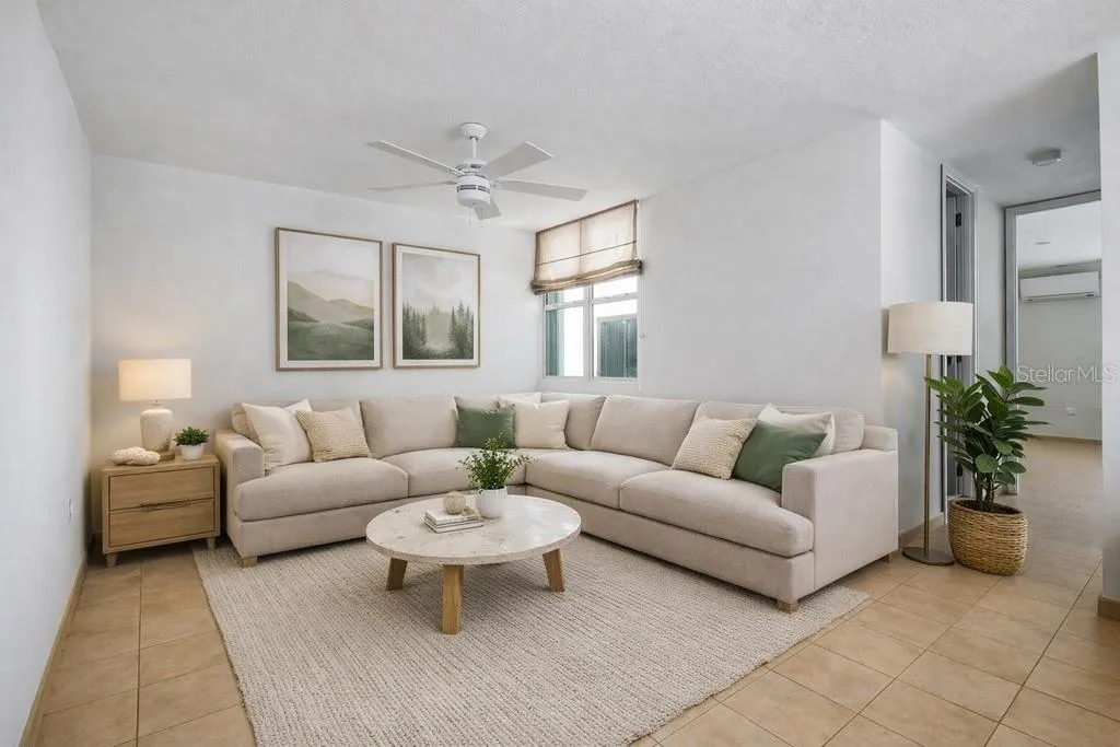 Living Area: Bright, expansive living and dining space with access to the open balcony area. AI-generated/AI-enhanced image for illustrative purposes.
