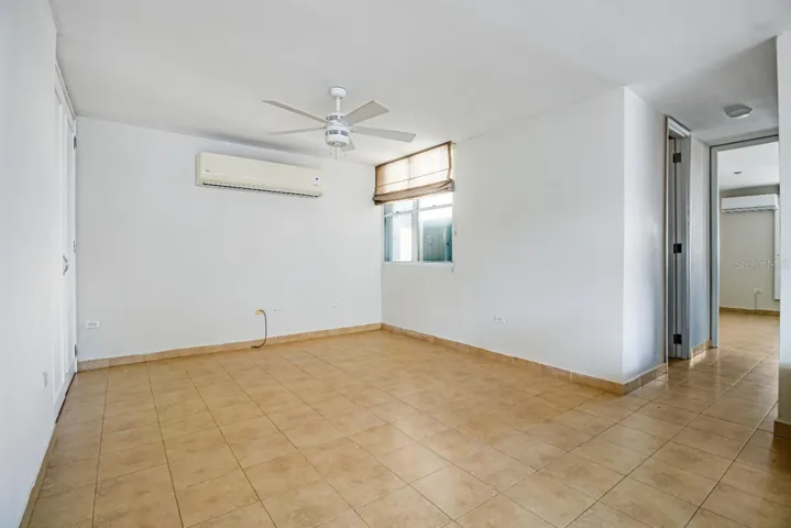 This space in the living room could be converted into a third room by building a wall, it has a closet and window.