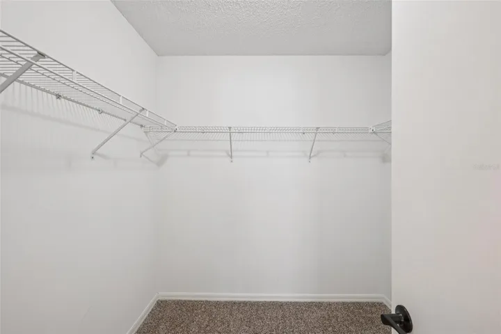 Primary walk-in closet.