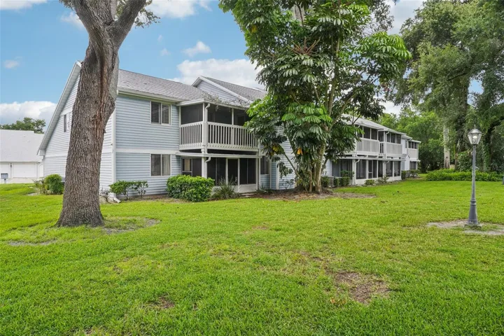 Screened balcony with views of lovely mature trees.