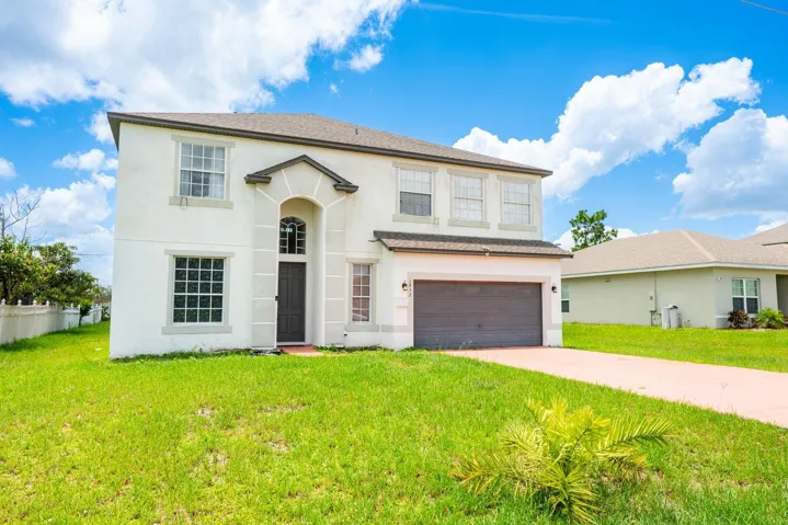 This spacious, 4-bedroom, 3-full and 1-half bath home in the heart of Poinciana Villages offers room to grow—inside and out!