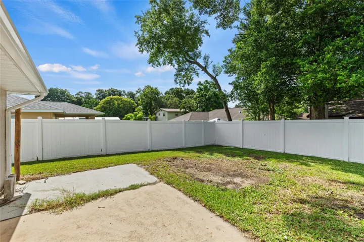 Back Patio and Vinyl Fenced in Backyard