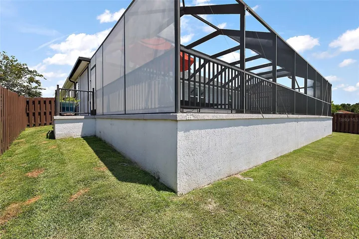 Rear/Side Elevation with Fenced Yard