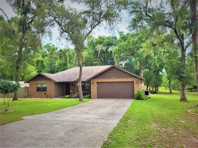 FRONT WITH LONG DRIVEWAY TO GARAGE