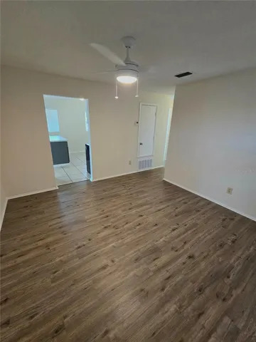 Living room and entrance to kitchen and dining area