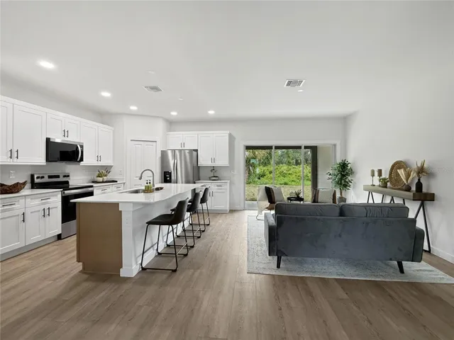 Kitchen & Living Room - photos of similar model, finishes may differ