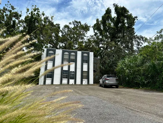 Street view to parking lot and building