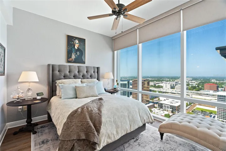 Primary Bedroom with view of Downtown Orlando, motorized blackout shades for privacy