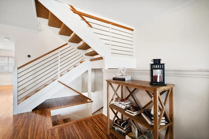 Staircase leads to master and additional bedroom upstairs.