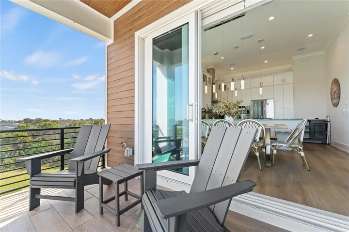 Indoor dining meets outdoor living—just steps from the kitchen to the balcony.