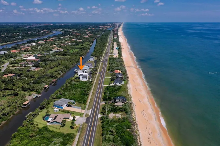 Coastal living at its best—this stunning property offers the rare combination of Intracoastal canal frontage and direct deeded beach access just steps away.