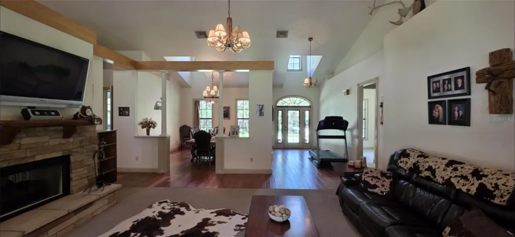 Living room looking toward the entry door and dining room
