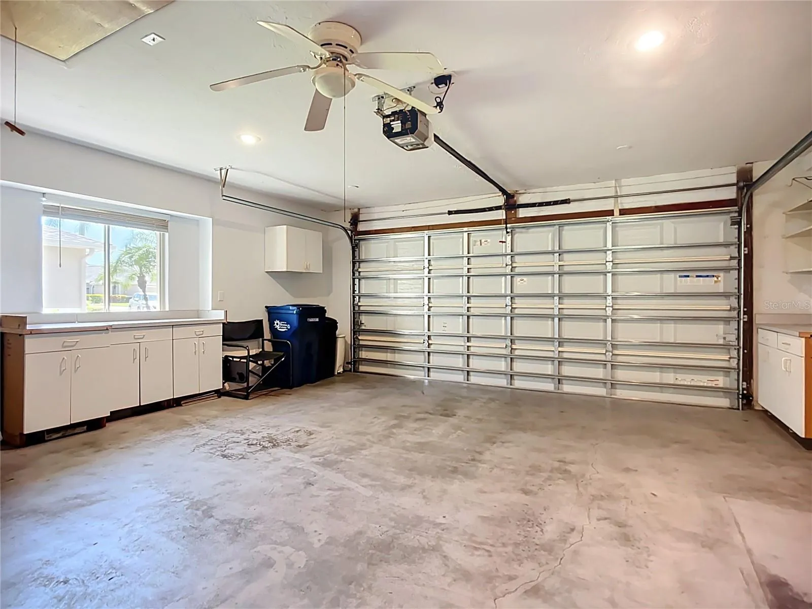Large 2-car garage has hurricane rated door