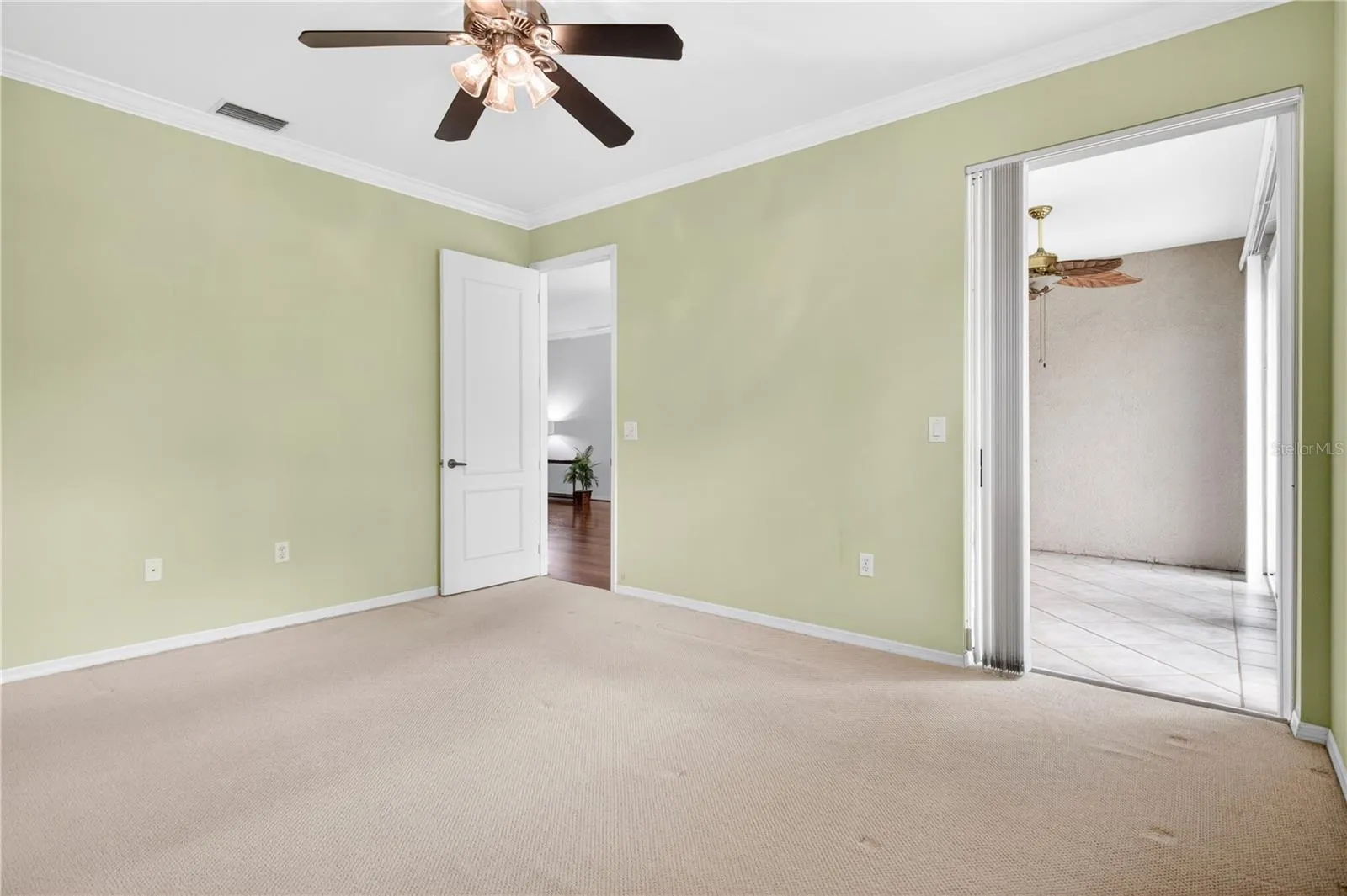 Primary bedroom has slider to lanai