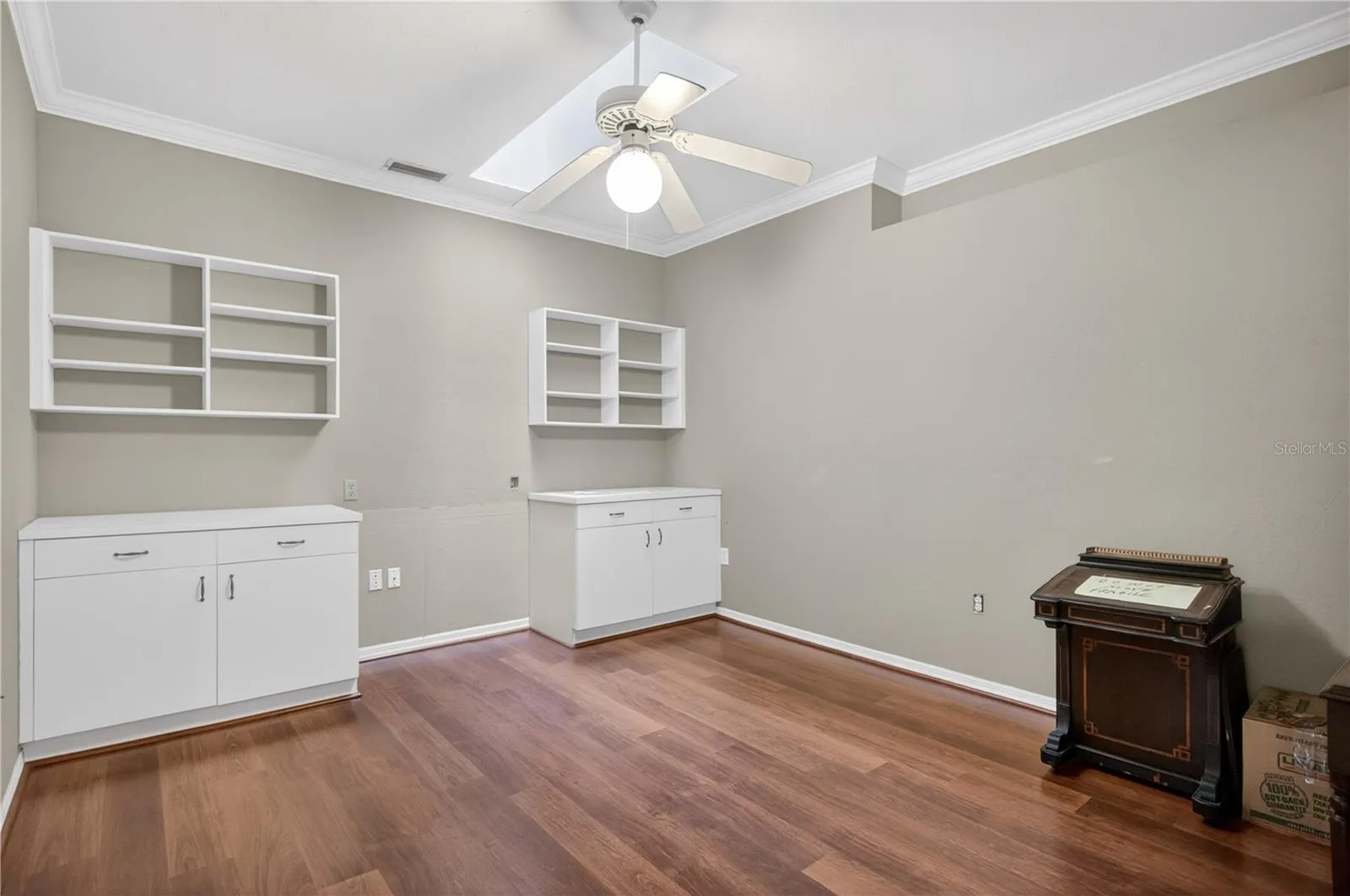 Den office at center of villa includes built in for office or storage