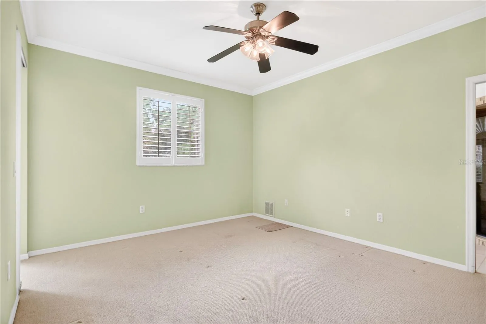 Primary bedroom large enough to host king bed, end tables, and additional furniture