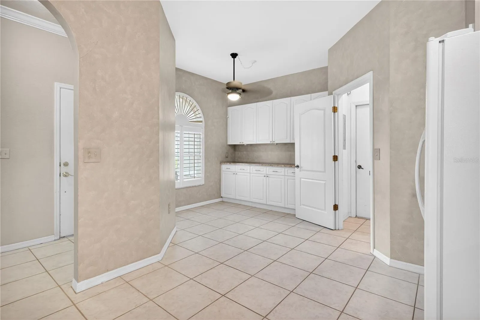 Breakfast nook and additional storage and coffee bar in kitchen