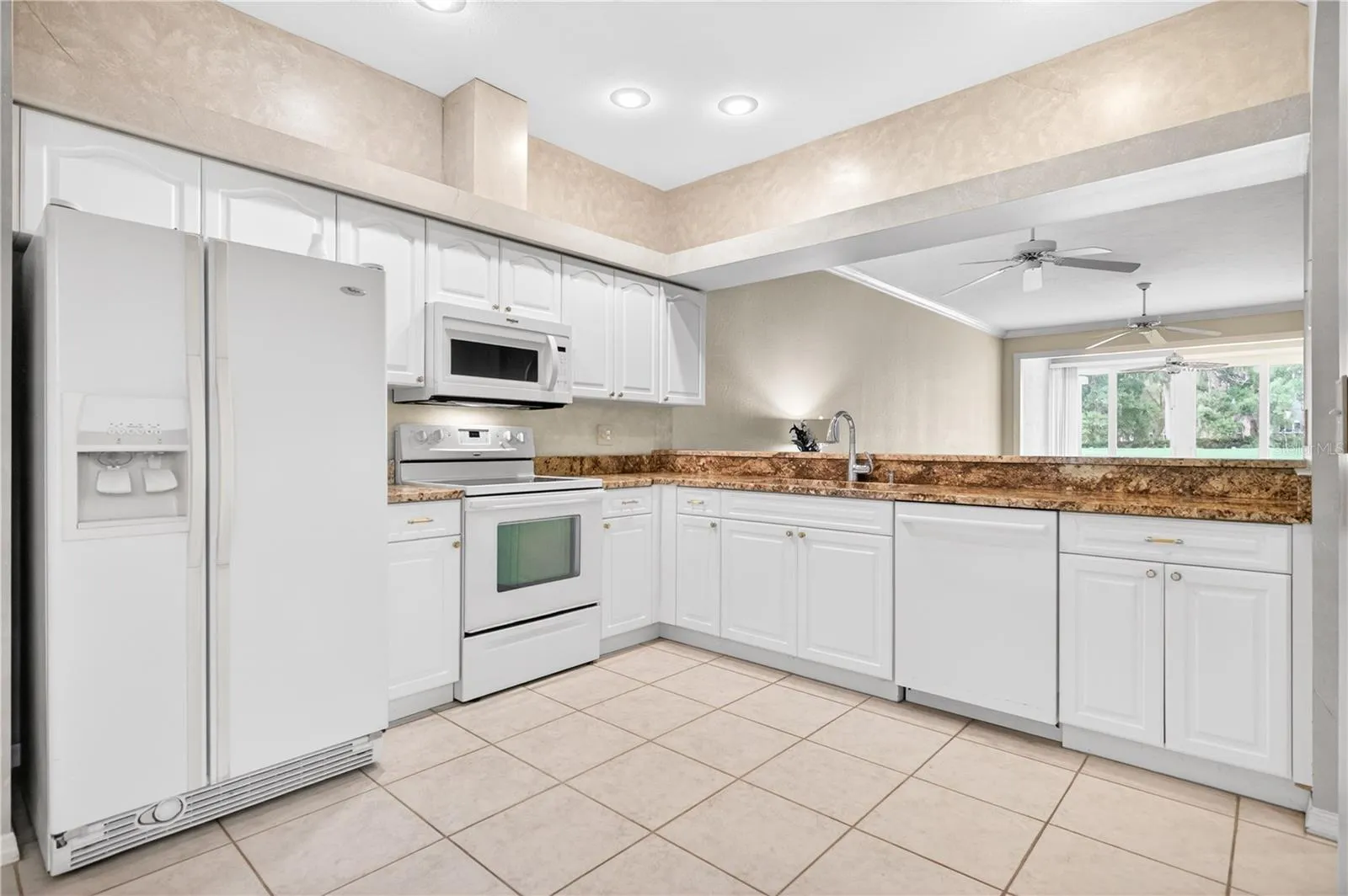 Kitchen is bright and open to main living spaces