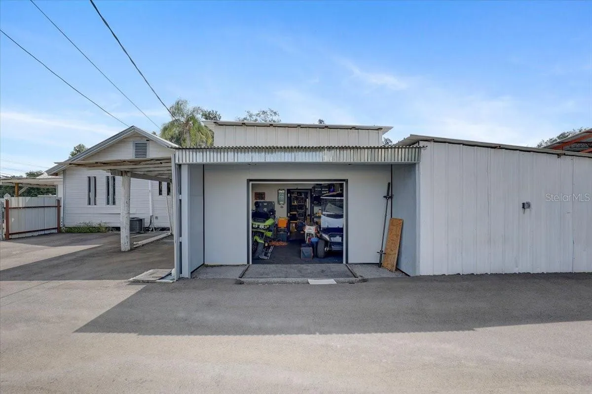 West side of main office storage with garage and remote opener