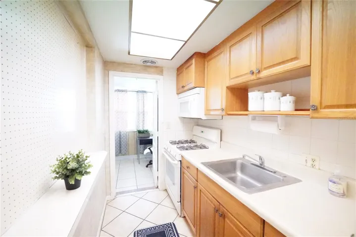 Kitchen with door open toward FL room