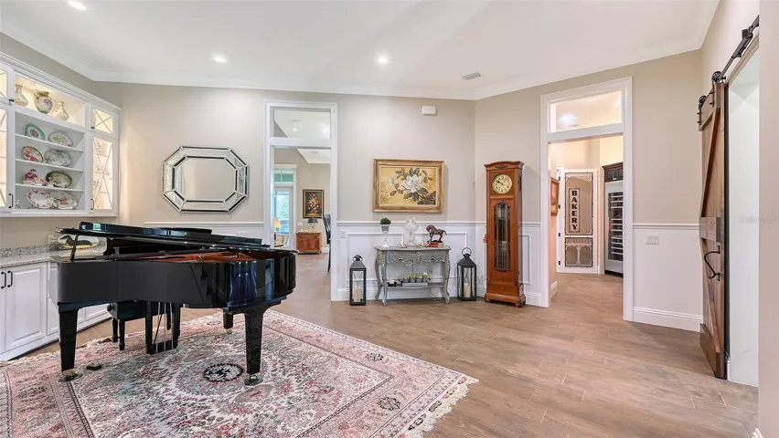 The Living Room leads directly to the expansive Butler's Pantry, Kitchen and Family Room.