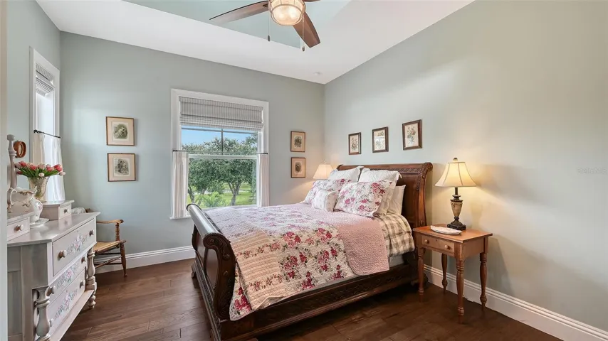 This inviting bedroom not only offers ample space for relaxation but also provides a stylish and functional storage solution, making it the perfect sanctuary for rest and rejuvenation.