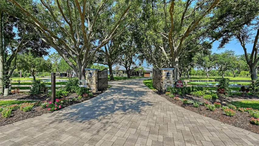 Grand Entrance: Four 24"x24"x6" gate columns clad in Tuscan Collection Brookwood ledgestone with stone caps, creating a striking first impression.  Cat 6 and power run to gate columns.