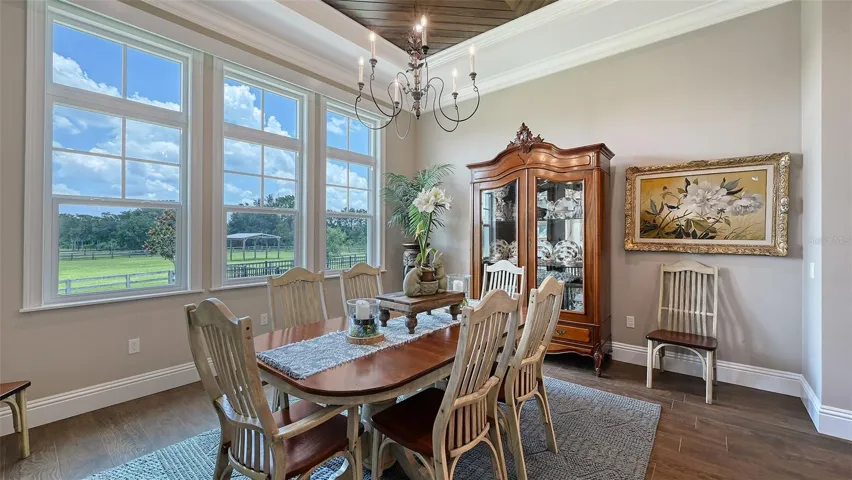 The interior glass transoms, adorned with elegant wood muttons, add a touch of sophistication to this delightful space.