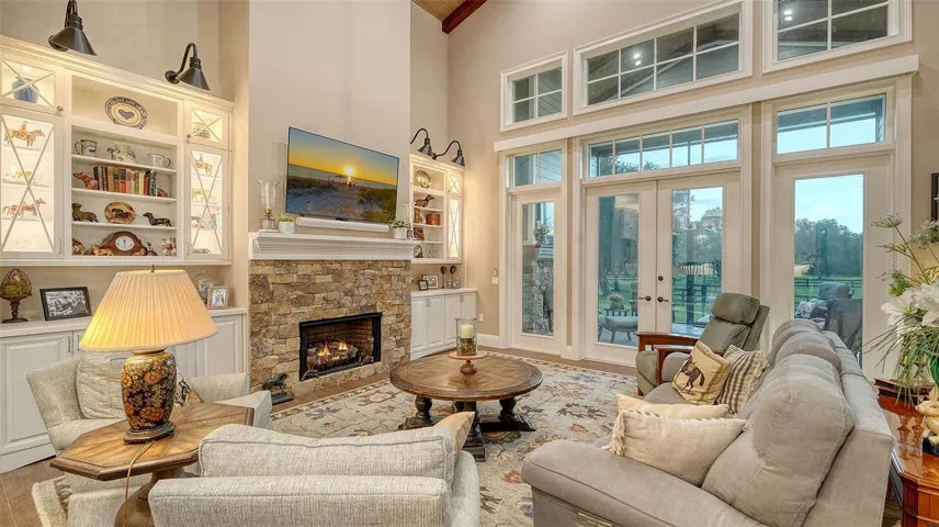 The Family Room, measuring 22' x 21', features a cozy gas fireplace enhanced by a 42" ventless design with HillCrest Sable Timber stone, extending from the floor to a 5" mantle. A stylish poplar mantle completes the look, adding warmth and elegance to the space.