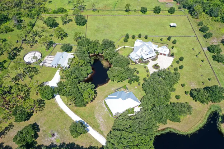 The main home, guest house, and barn all overlook picturesque reflection ponds (there are 2 of them).  Nestled on a very quiet cul-de-sac, peace and quiet are yours!