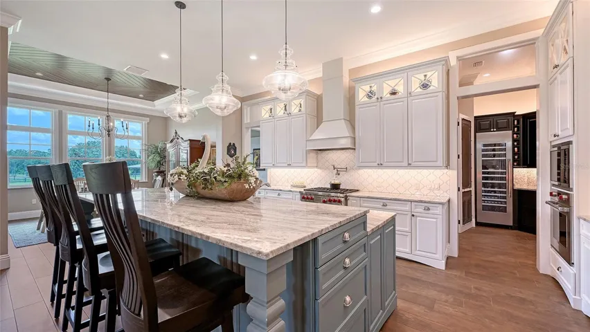 This magnificent kitchen boasts an array of exceptional features, including a state-of-the-art appliance package. The main kitchen is equipped with a SubZero 42" refrigerator, a Wolf 36" 6-burner gas stove, a Wolf microwave, a double oven, a dishwasher, and a hood insert, ensuring both functionality and style for all your culinary endeavors.