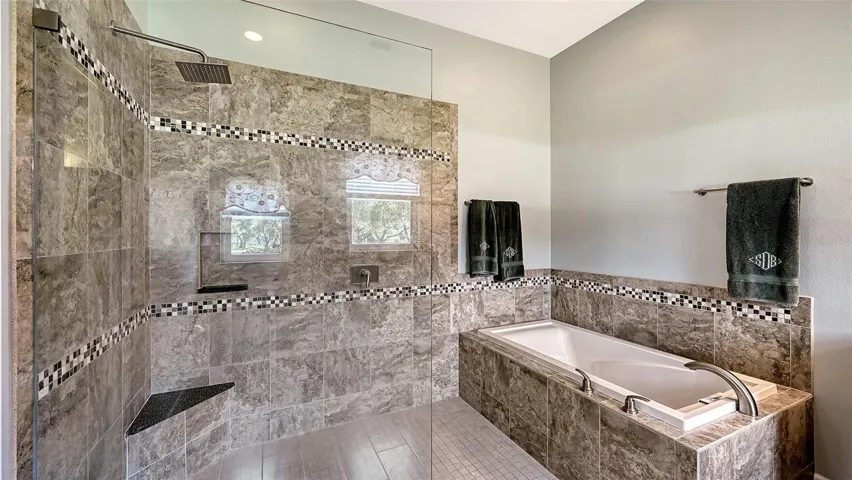 The contemporary Spa Bathroom is a luxurious retreat, featuring an oversized soaking tub that invites relaxation, a spacious walk-in shower.