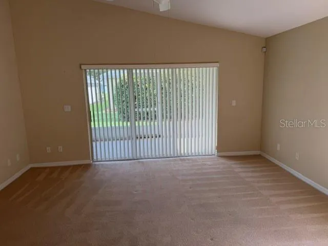 Dining Room W/Triple Panel Sliding Glass Door to The Lanai
