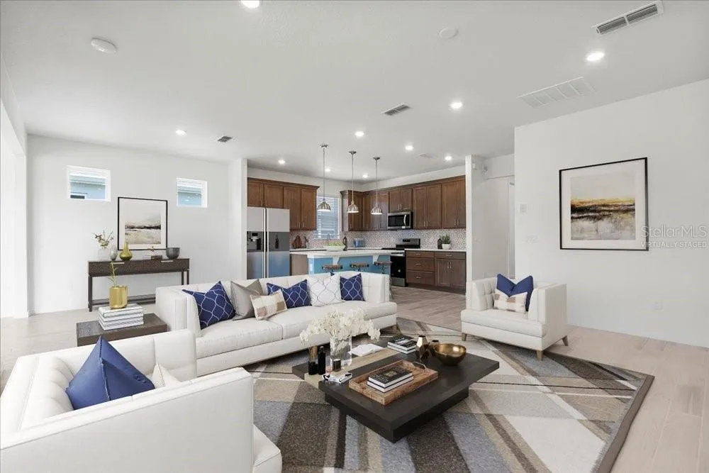 family opens to kitchen - virtually staged