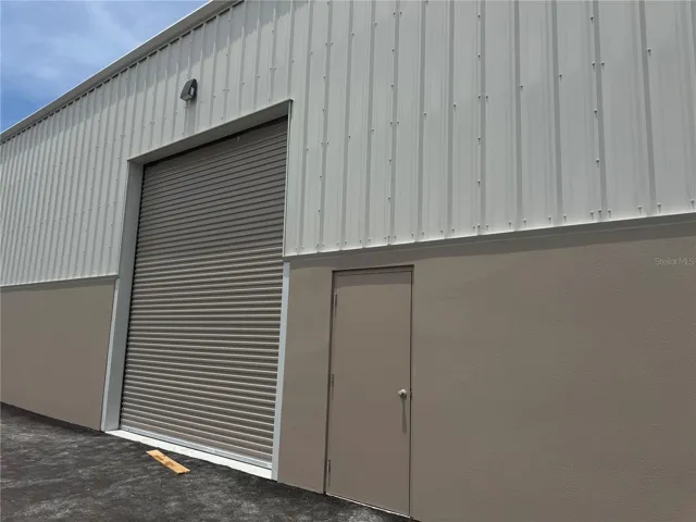 Unit C entrance plus roll up door