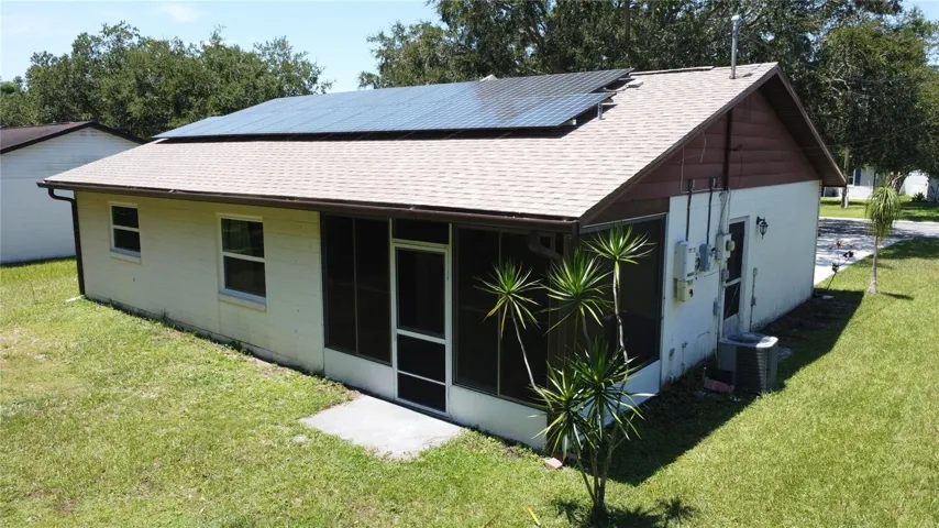 View of back house with solar panels