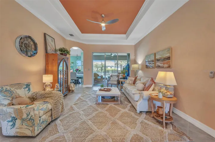 Sliding glass door from formal living room to lanai and pool.