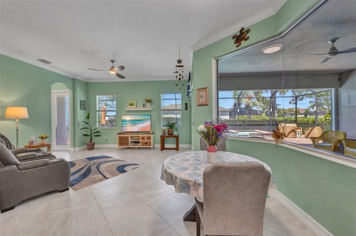 Dining at the breakfast nook with a view of the lanai and pool.