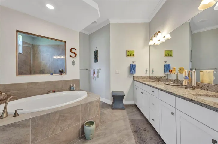 Crown molding completes the aesthetics of the primary bathroom.