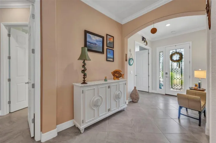 Beautiful entrance foyer with leaded glass front door.