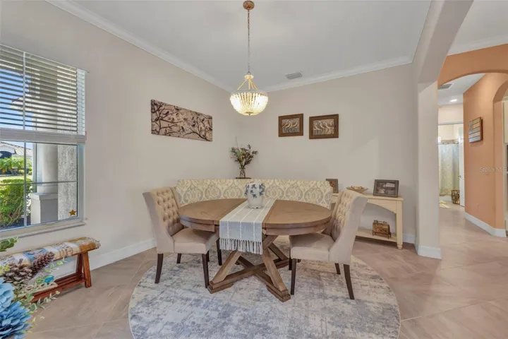 Spacious dining room with crown molding.