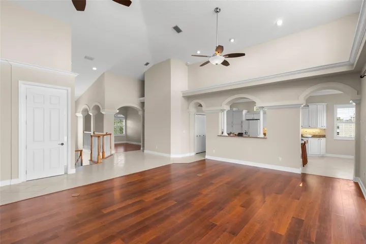 Elevator Door Is Left Of Stairs, Dining Room is Right of Stairs With The Hallway Leading To 2nd Upstairs Bath and 3rd Bedroom