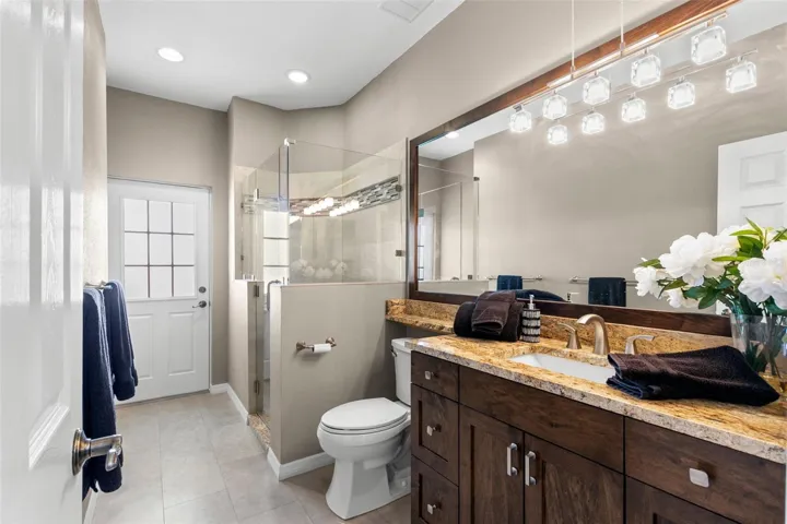 First floor full bath with step-in shower and pool access