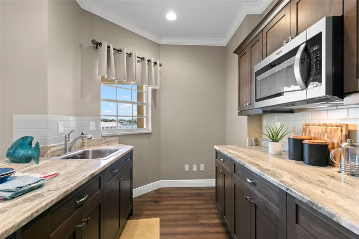 1st Floor Kitchen, Is Wired For Stove At The End Of Counter On Right Side Of Photo (Includes Mircowave, Refrigerator, and Sink