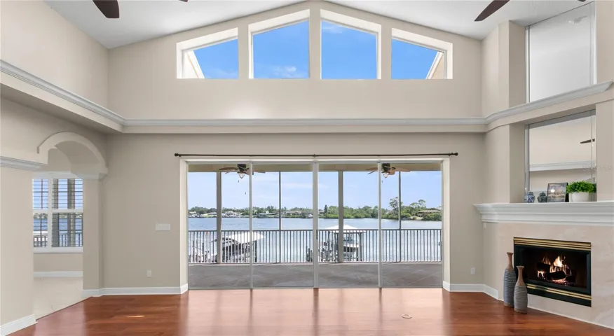 Great room waterfront view and fireplace