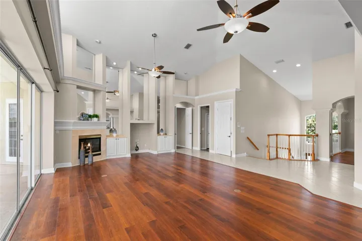 Main Living Area Looking Towards Primary Bedroom and 2nd Bedroom and Elevator Next To the Stairs