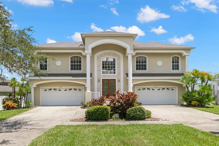 Front of home with double 2 car garages.