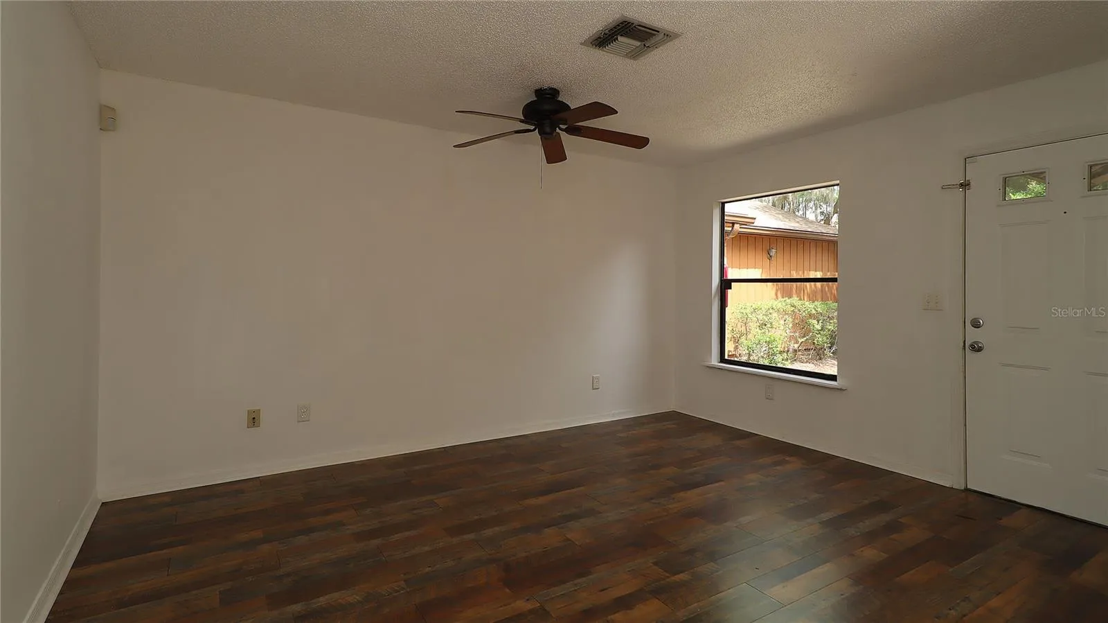 then enter into spacious living  room...