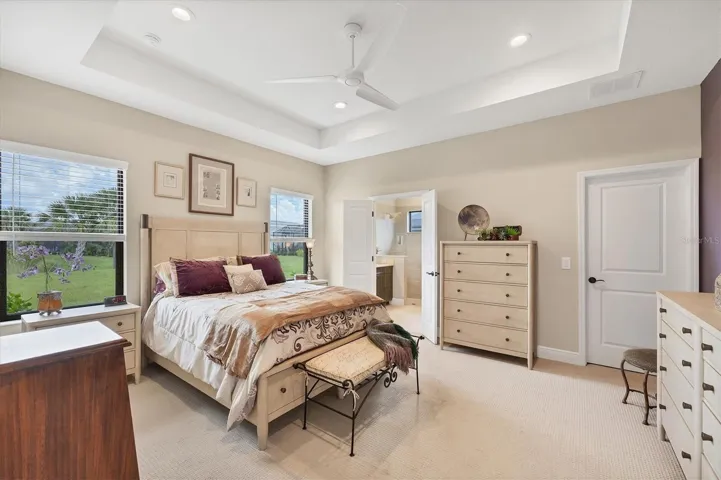 The primary suite is a peaceful respite after a fun-filled day at nearby Englewood Beach.