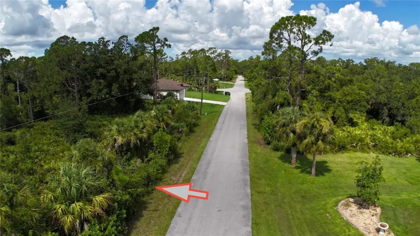 Street view with the lot on the left.  Looking westward towards Commerce St.